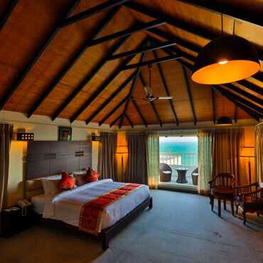 bedroom with wooden design in annai resorts